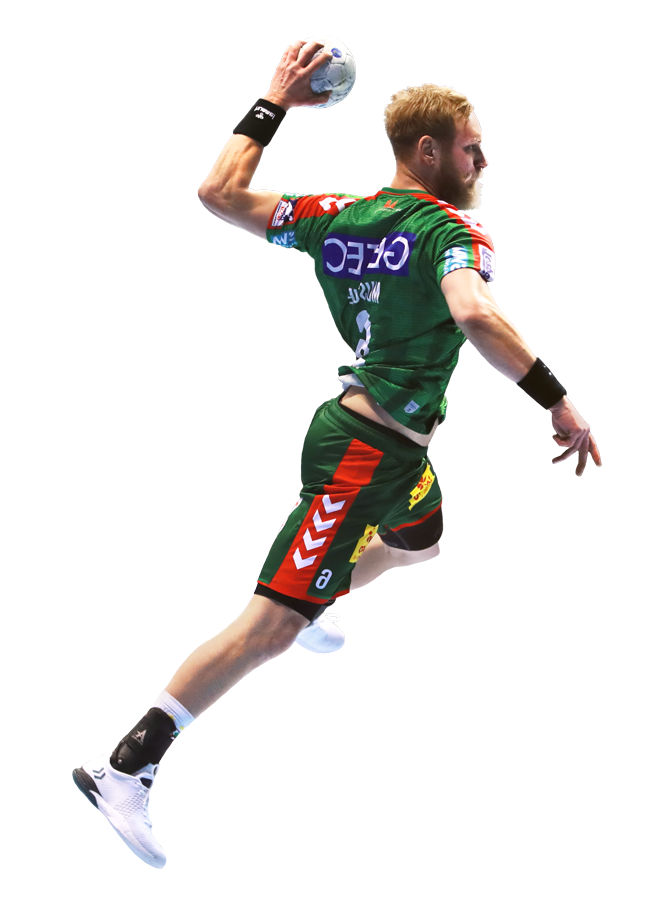 Matthias Musche springt mit einem Handball in der linken Hand
